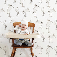 Vintage style exotic birds wallpaper for kids interiors in light neutral color palette