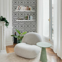 eclectic apartment corner with tribal print inspired wallpaper design in black and white