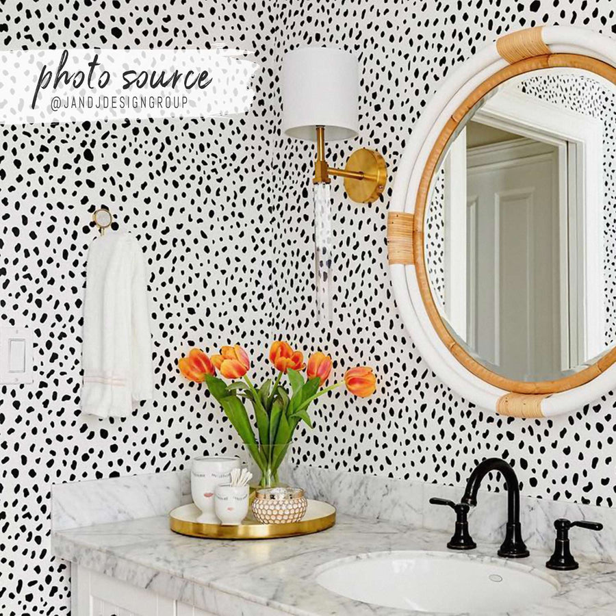 Eclectic girls bathroom interior with black dalmatian print wallpaper