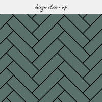 green herringbone tile backsplash