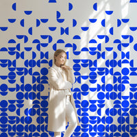 geometric circles print wall mural design in bright blue color