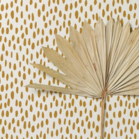 bright faux gold spots wallpaper for tropical interior