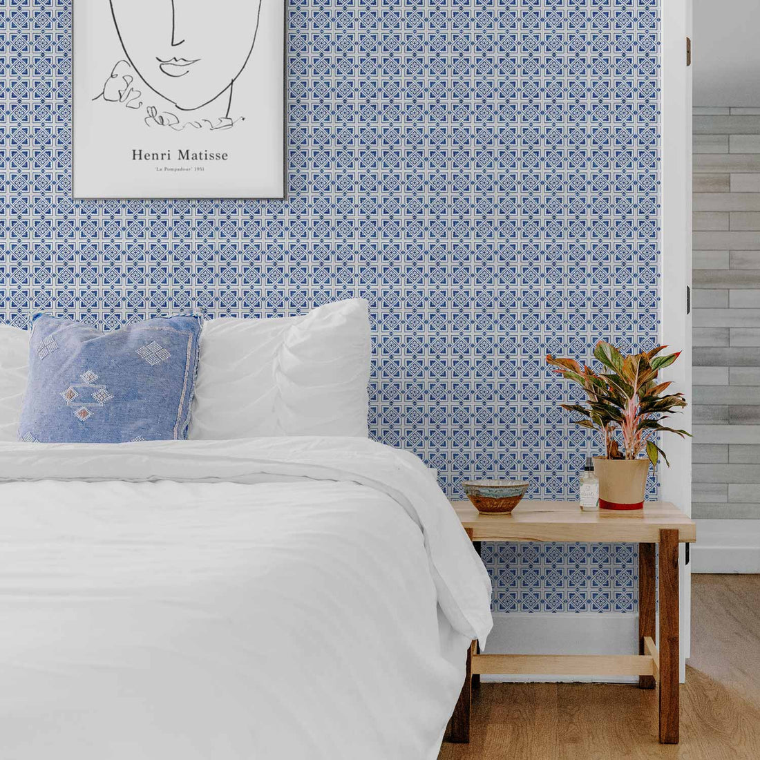 blue spanish design bedroom interior with tile pattern wallpaper
