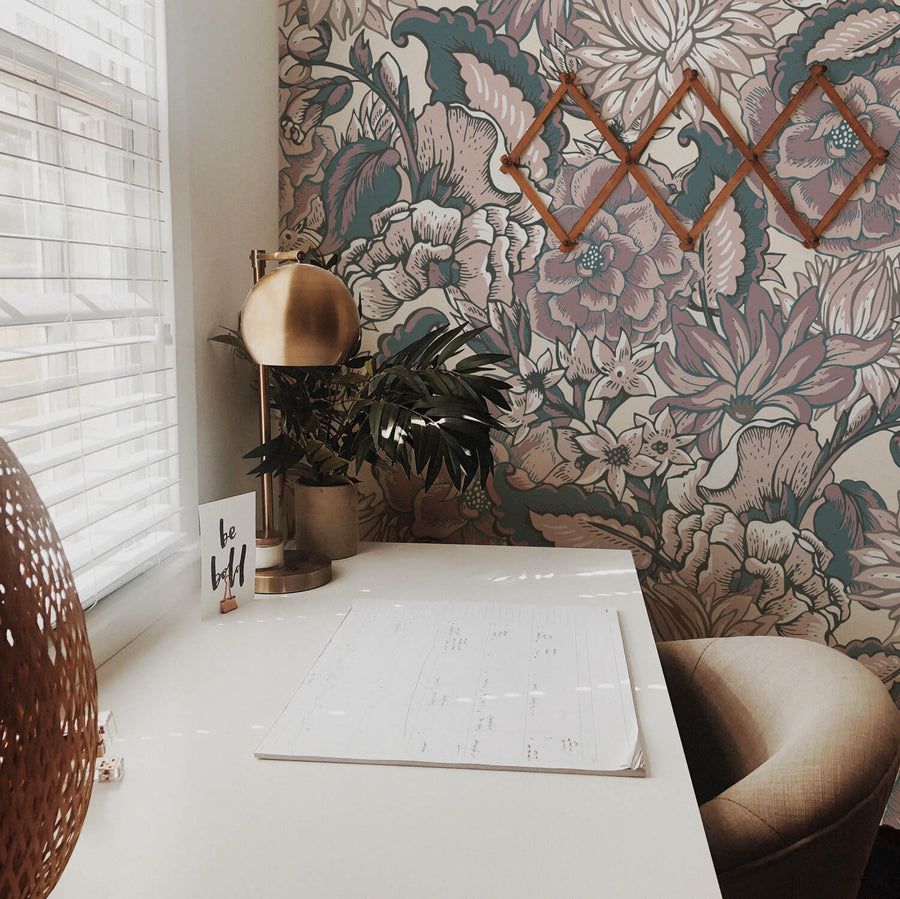 Boho style home office nook with bold floral design feature wall