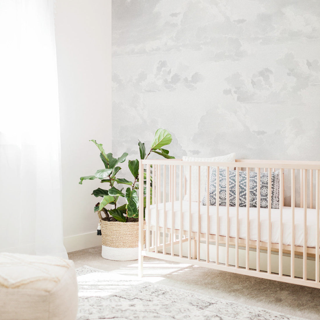Gender neutral nursery interior with coastal style and vintage clouds removable wall mural wallpaper