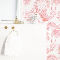 Coral removable wallpaper in elegant white and gold bathroom interior