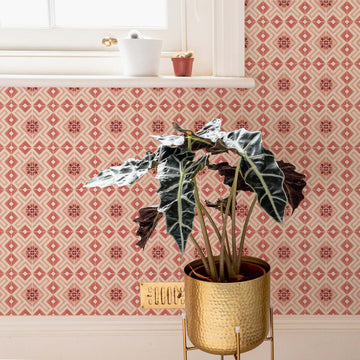 Pink moroccan tiles removable wallpaper in kitchen or bathroom interior with gold planter and cactus plants