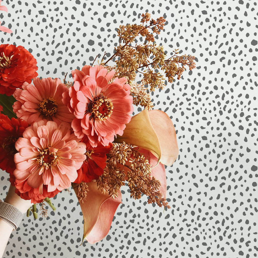 Grey animal print removable wallpaper as a backdrop for flower arrangement photography