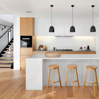 Modern white kitchen interior with wallpapered kitchen island