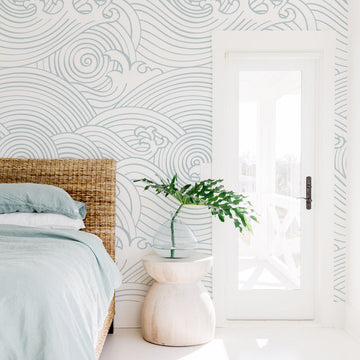 White modern coastal style bedroom interior with oversized waves wall mural wallpaper