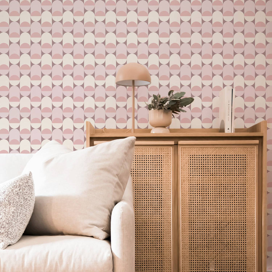 pastel pink geometric circles wallpaper in living room setting