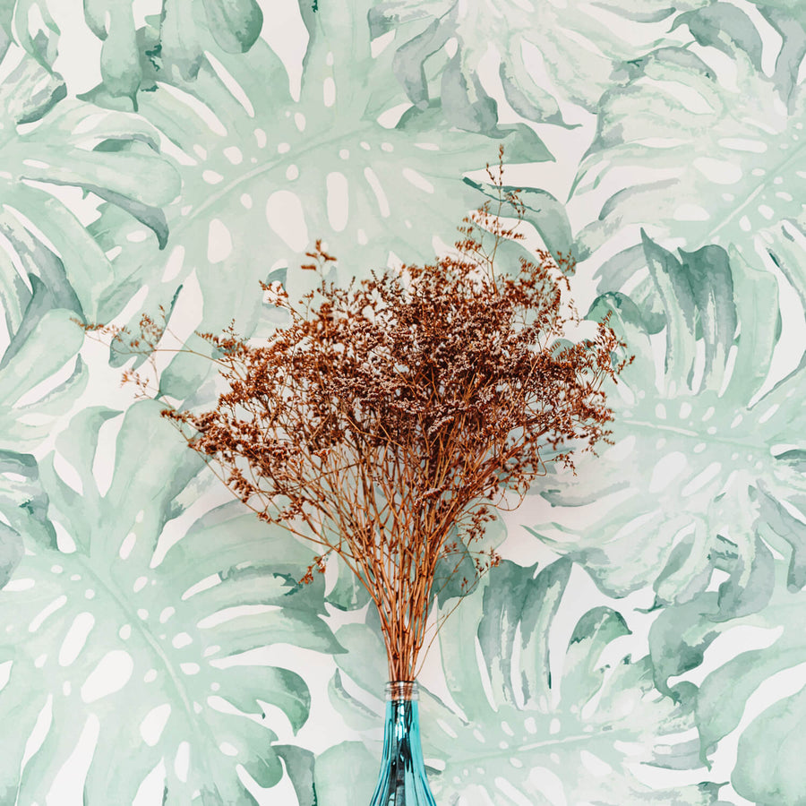Tropical green palm leaves removable wallpaper by Livettes