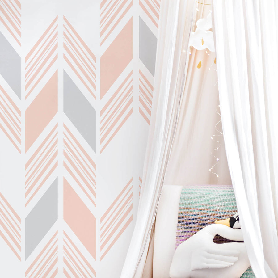 Pink herringbone removable wallpaper in white modern nursery interior