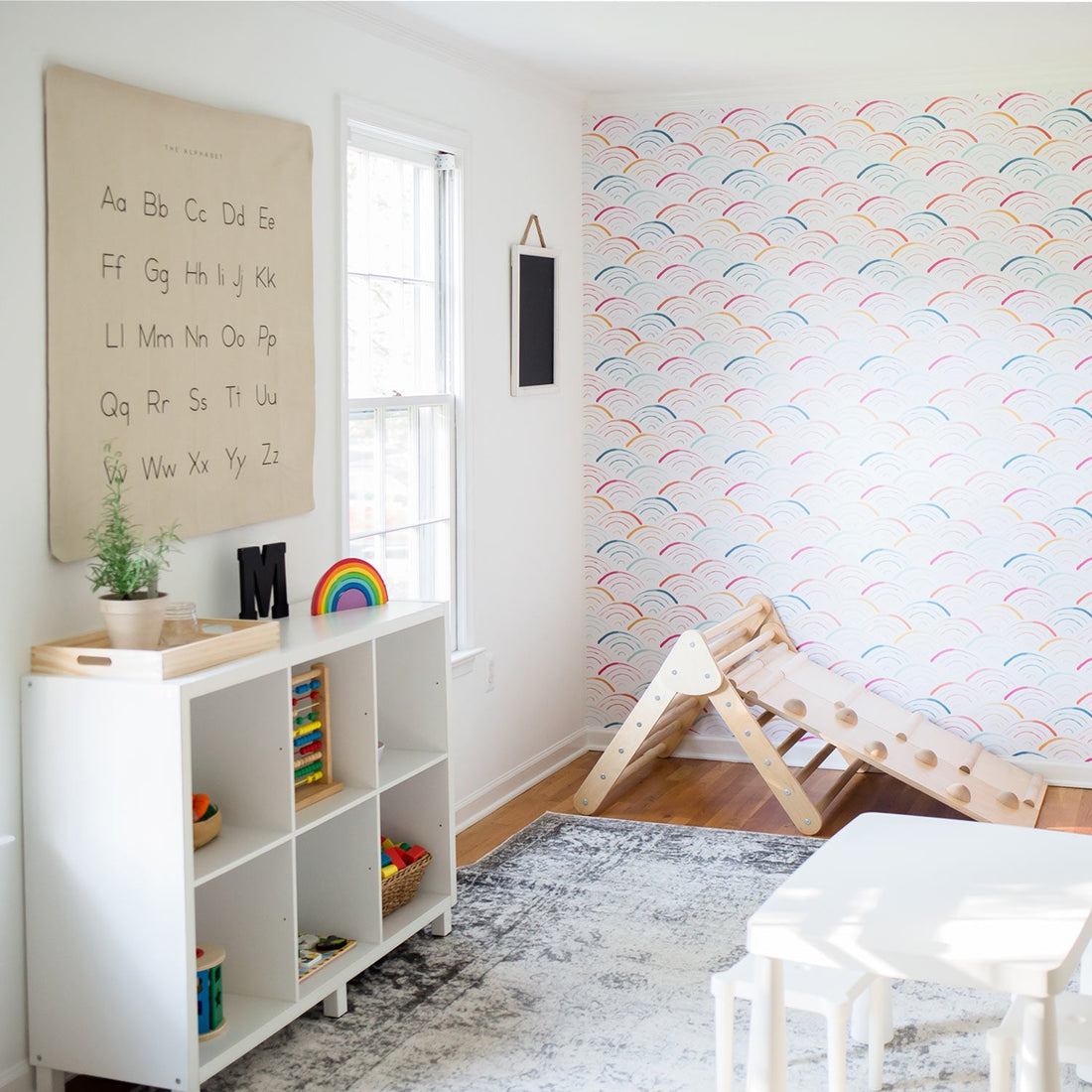 colorful rainbow pattern wallpaper for kids playroom design