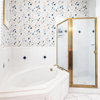 Pastel color terrazzo design wallpaper in white and gold bathroom interior