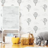 light grey wallpaper with travel inspired print