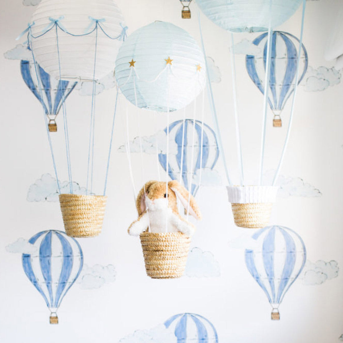 watercolor blue wallpaper with tiny air balloon print for kids bedroom