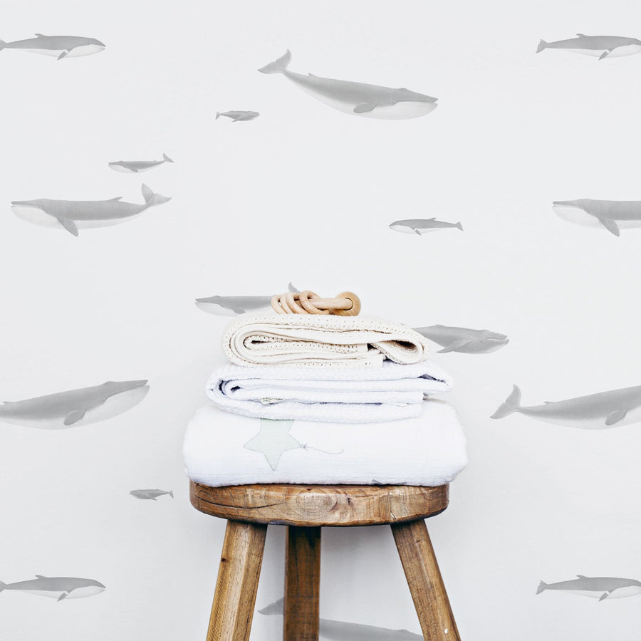 light grey coastal style wallpaper design with whales