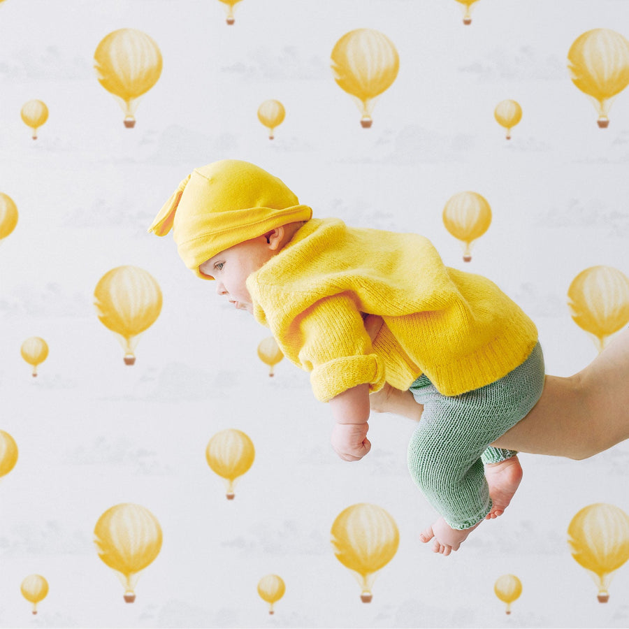 bright yellow air balloons inspired removable wallpaper for nursery interior