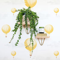 bright yellow traveling inspired wallpaper with small air balloons