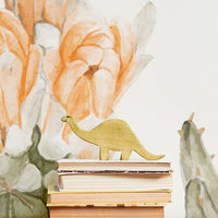 Desert theme nursery interior with cactus and dinosaur room decor and removable wallpaper